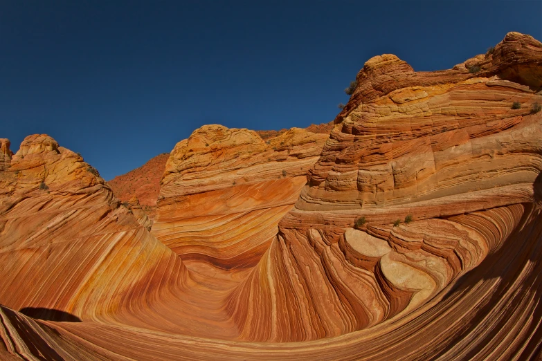 view of a very high canyon that is carved into the side of a mountain