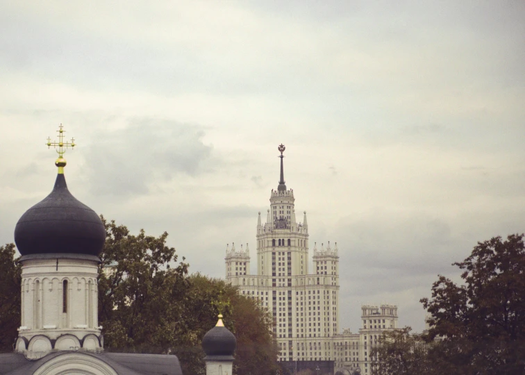 the church tower in front of a large white building