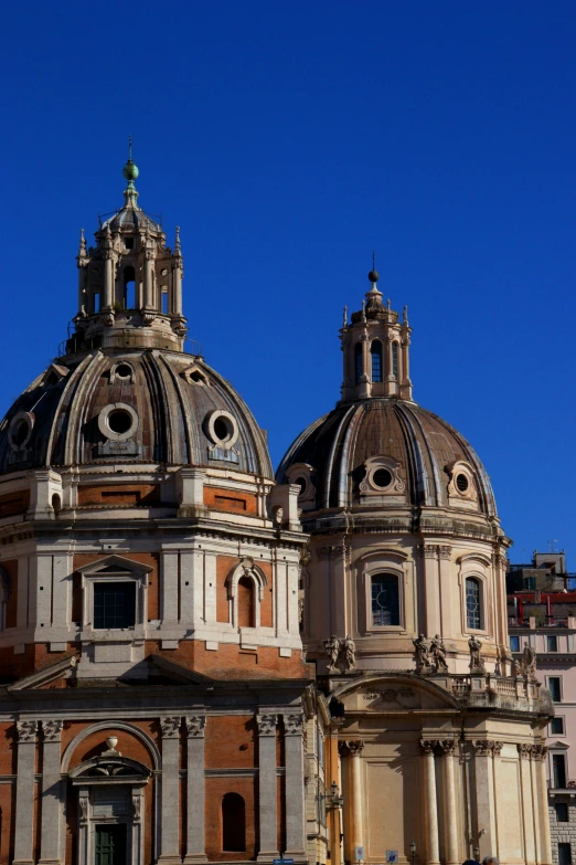 a beautiful old building has a steeple with domes