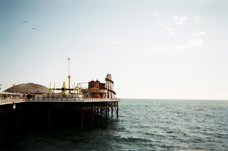 a small pier with lots of buildings in the distance
