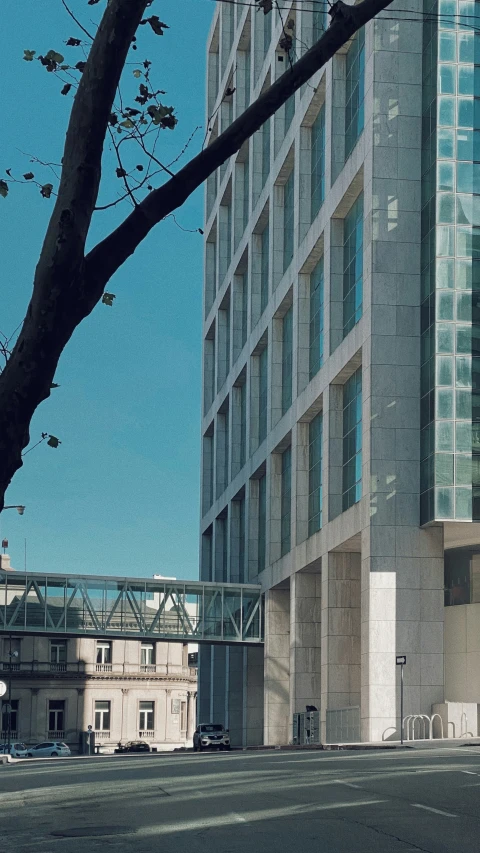 a person riding a skateboard near a tall building