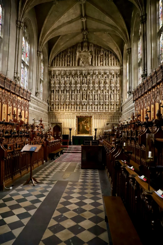 a building filled with lots of wooden chairs and furniture