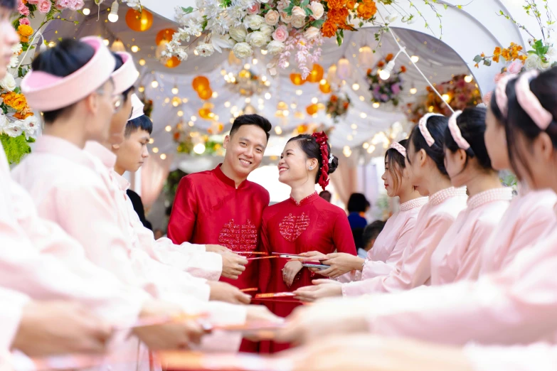 the couple smile while they talk together at a wedding