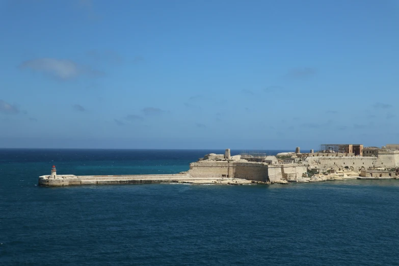 this picture is a s of an old fort on the water