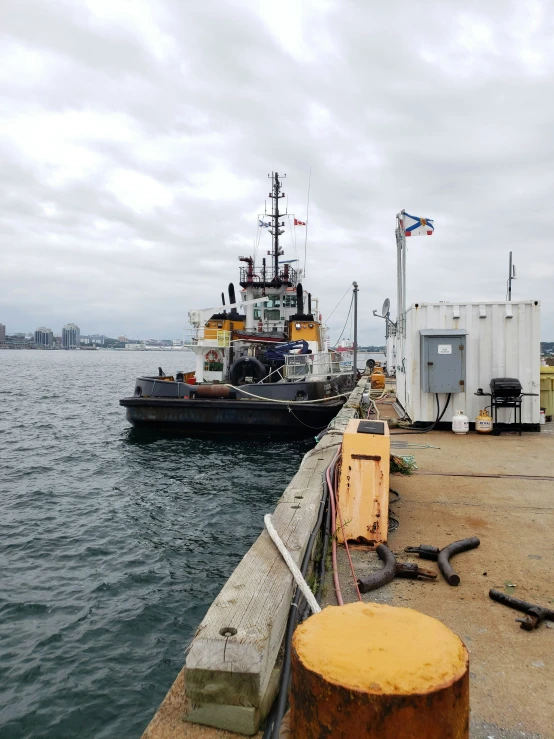 the boat is docked at the dock with its roped off