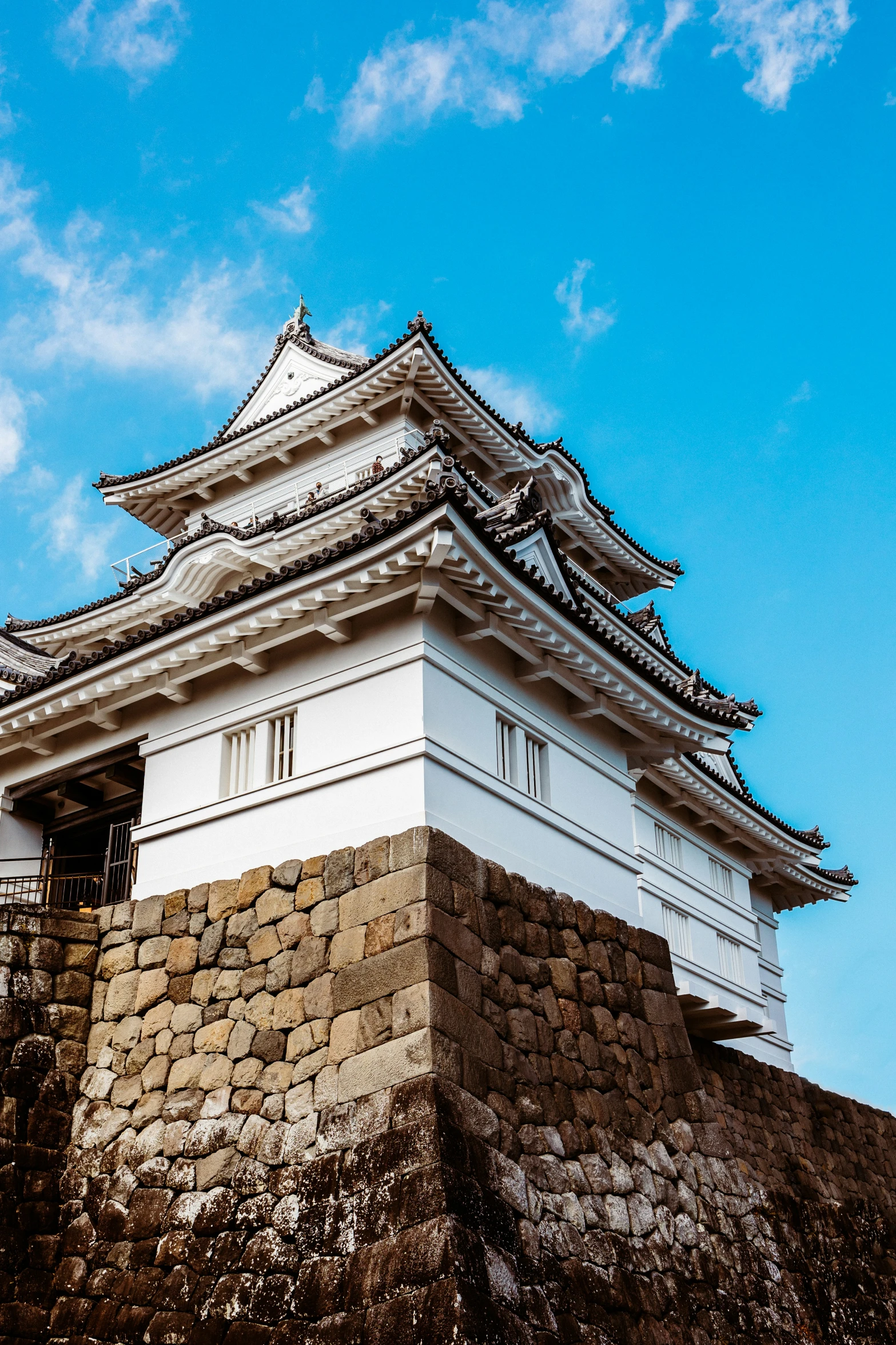 the top of a tower with a blue sky in the background