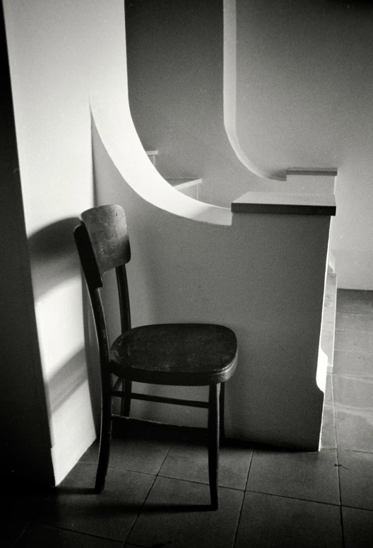 black and white pograph of an empty chair