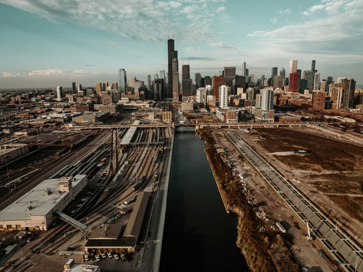 a waterway next to the city and train tracks