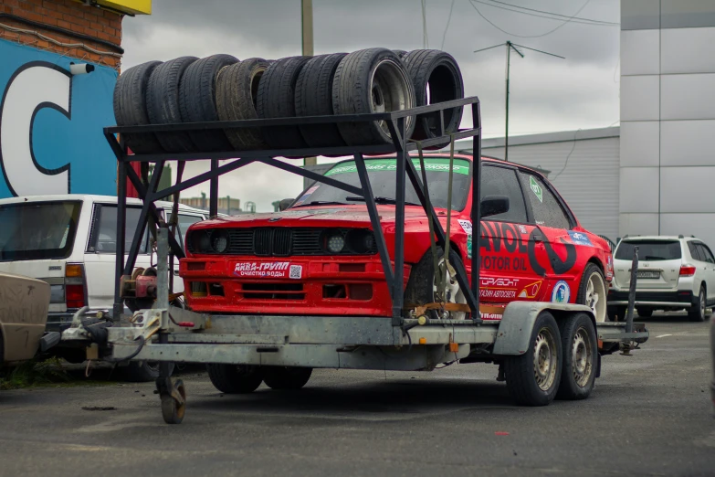 a truck with an all terrain tire rack attached to the flatbed
