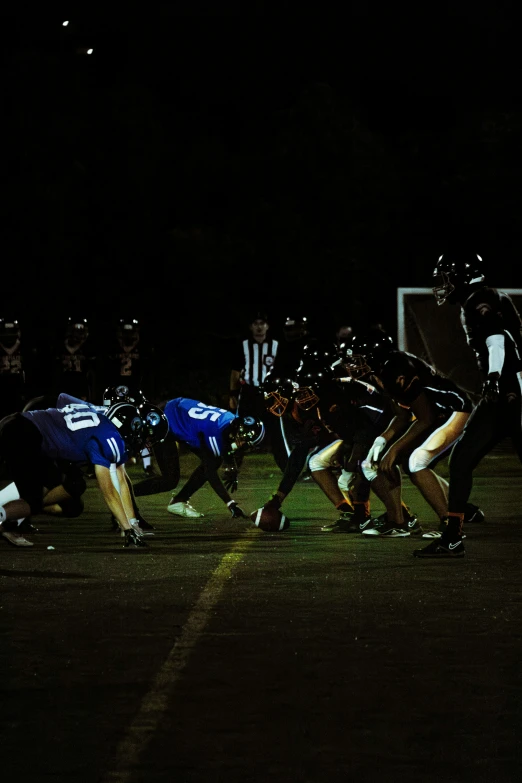 a group of young men standing next to each other on a soccer field