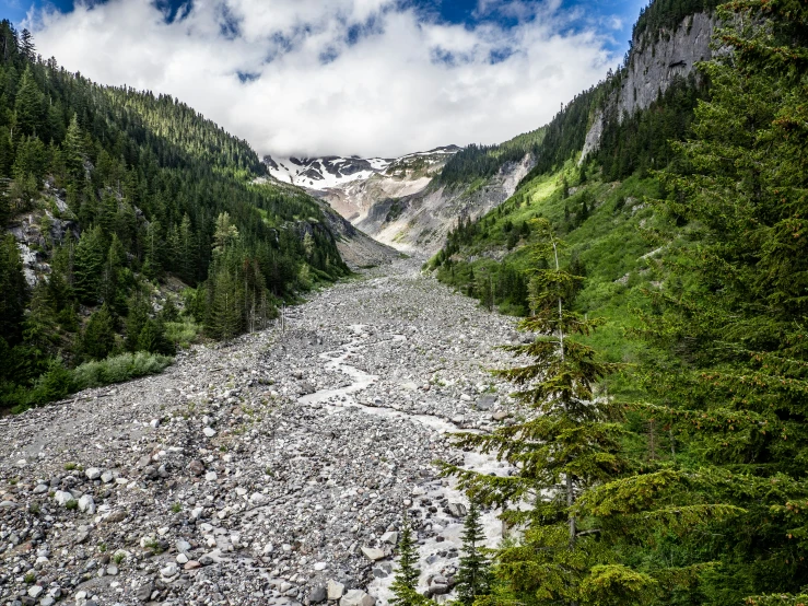 an image of a river in the middle of a mountainside