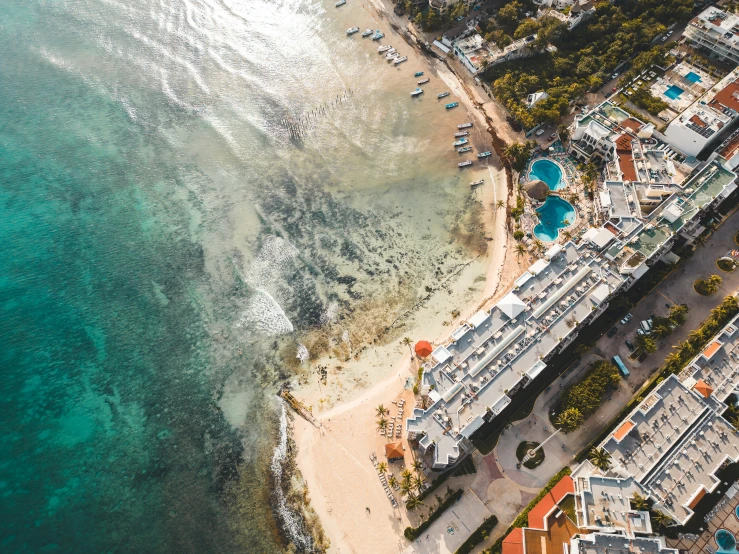 an aerial view of a town next to the ocean