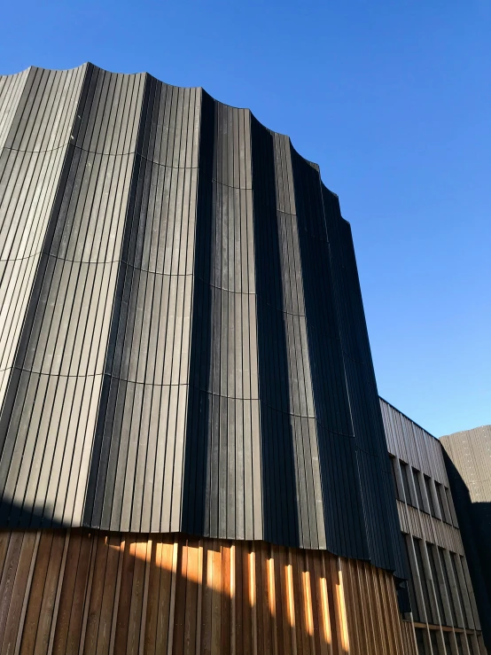 the side of a building with vertical corrugated sidings