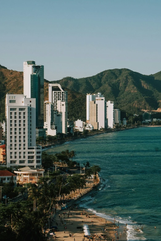 an overview of a beach area near city buildings