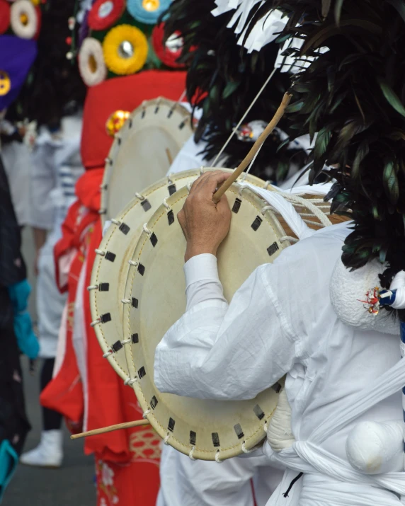 there is a parade with an elaborate decorated drum