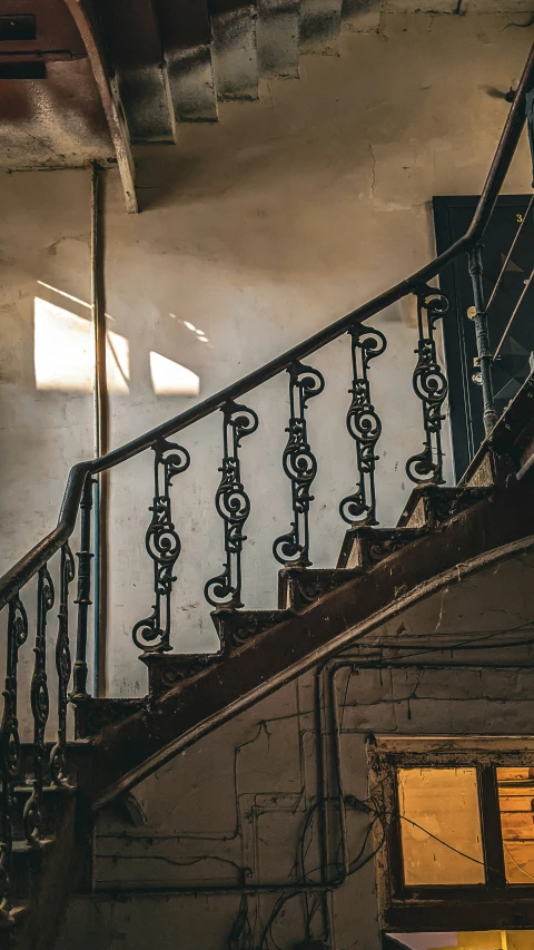 an upward view of some metal railings and railing rail