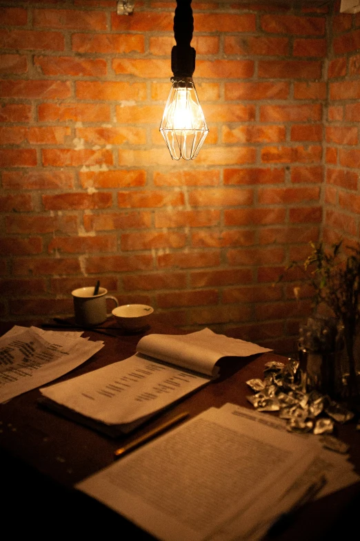 a table with papers and an old light bulb