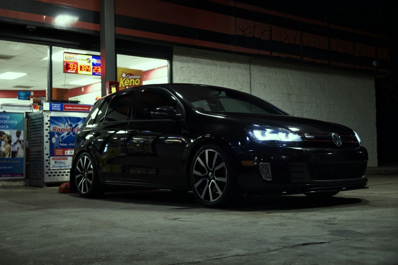 a volkswagen golf gtv parked in front of a store