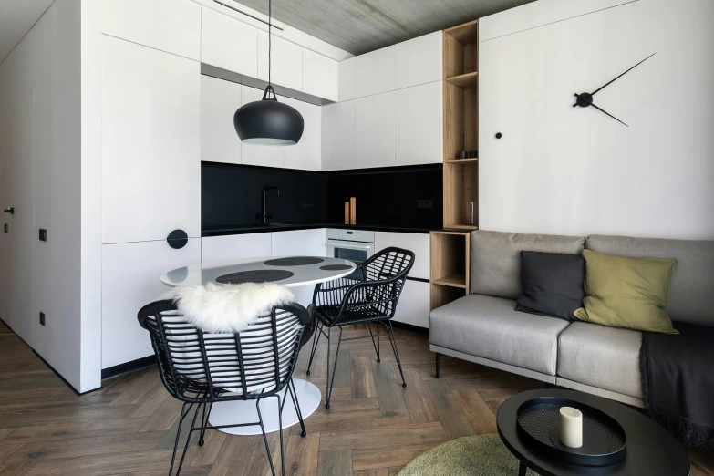 a modern and white living room with black accents