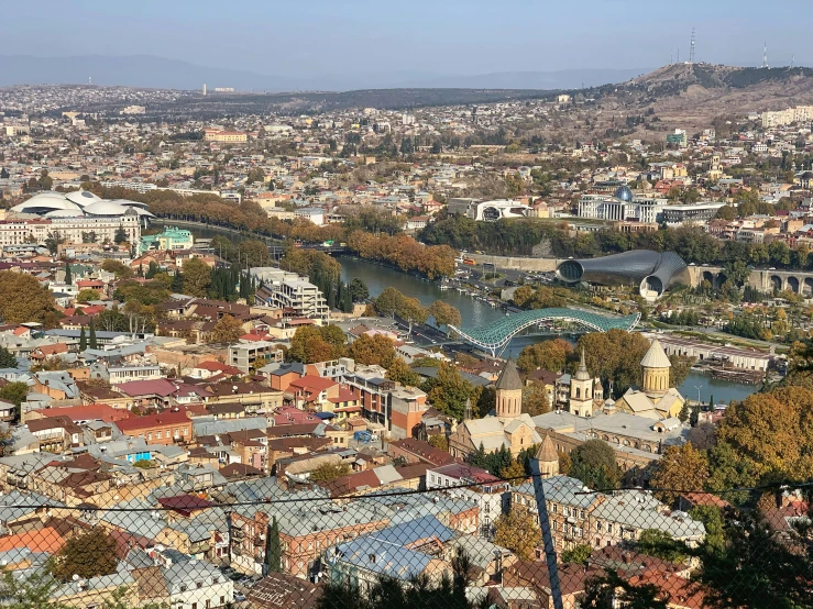 an overview of the city from atop a hill