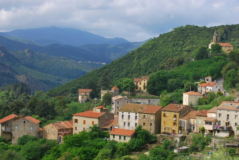 a scenic view of village on a mountain top