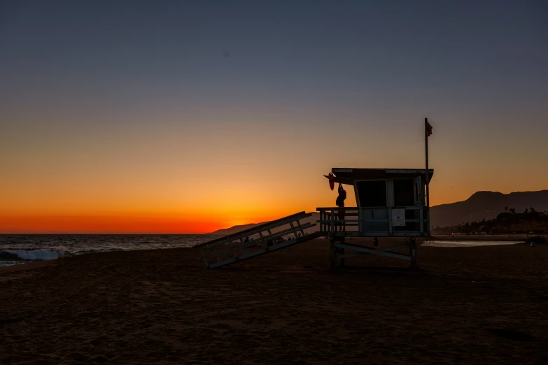 there is a lifeguard tower on the beach