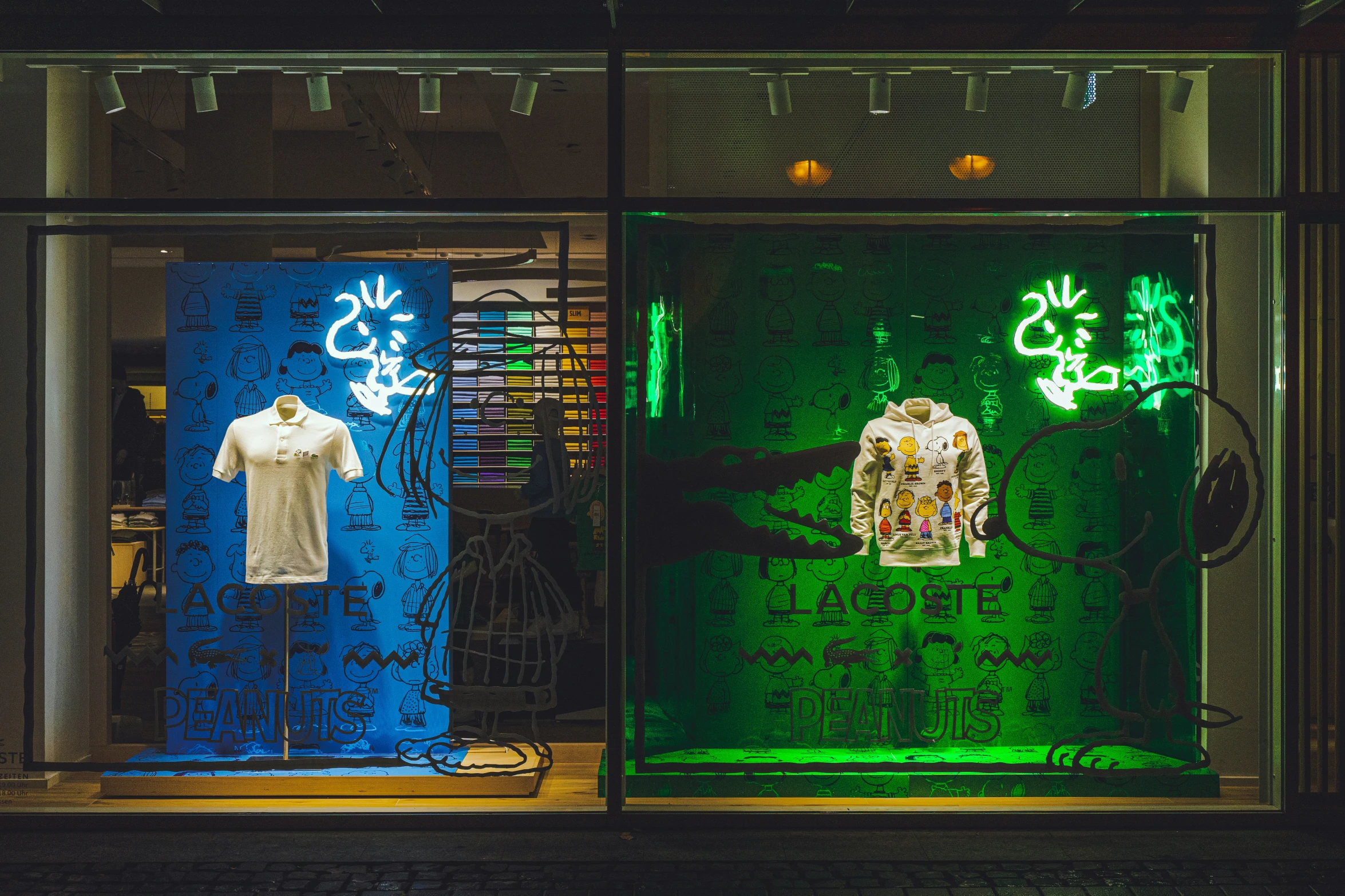 a window display featuring different types of clothing and lighting