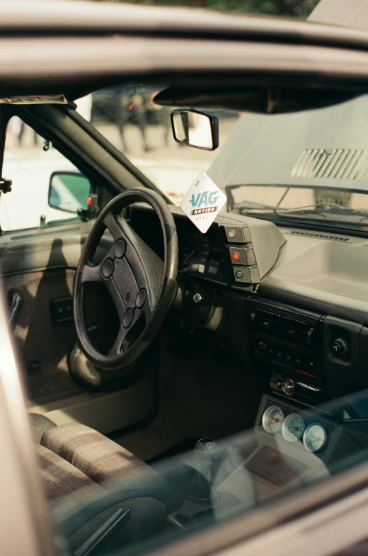 this is a car dashboard showing the steering wheel and dashboard