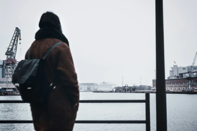 there is a person that is walking across the pier