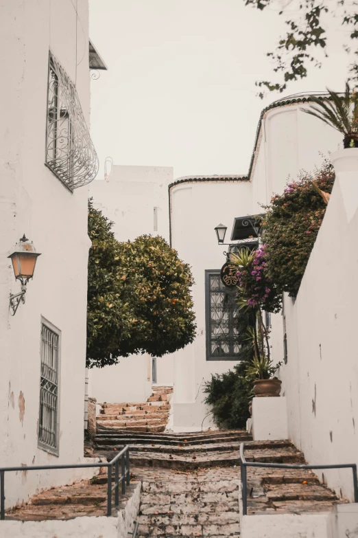 a street with some stairs going up a hill