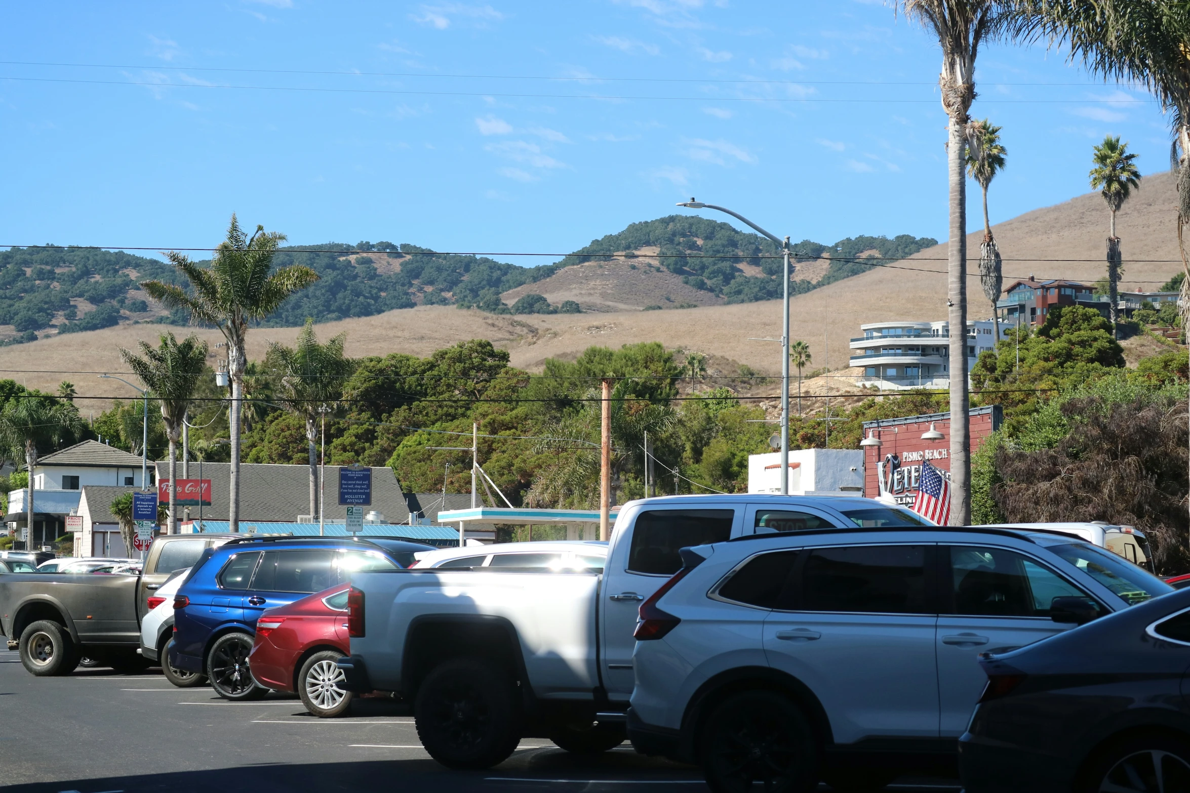 vehicles are parked in a line along a street