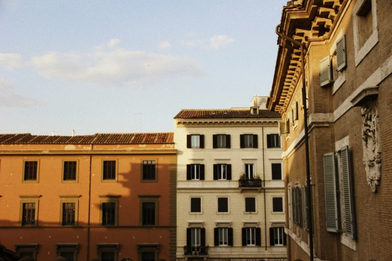 an alley way with old buildings in the background