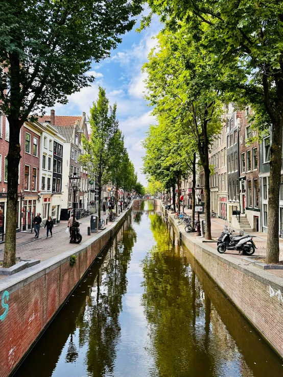 a waterway is shown near the shore on a sunny day