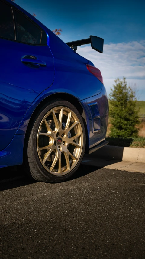 blue car parked on the side of the road