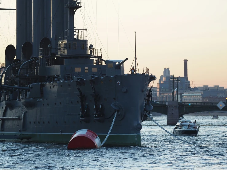 a large military battleship floating on top of water