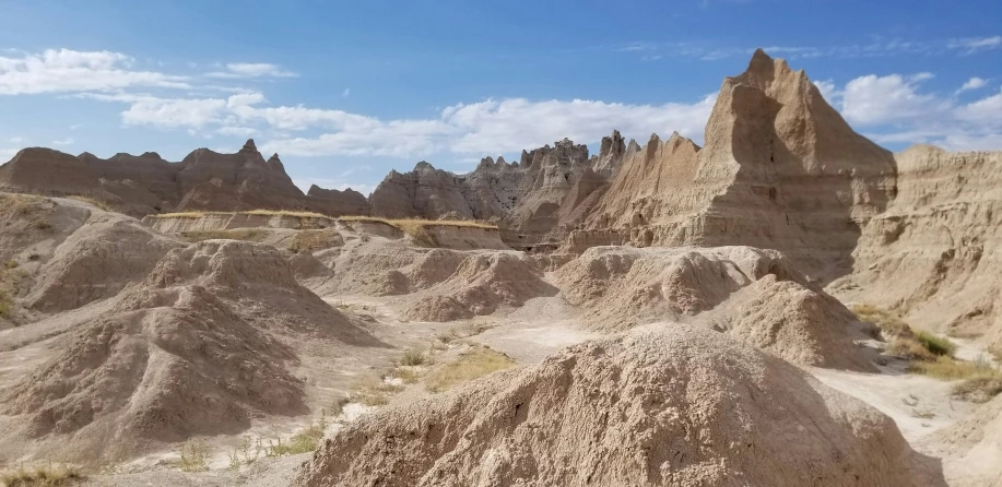 a large sandy mountain filled with lots of dirt