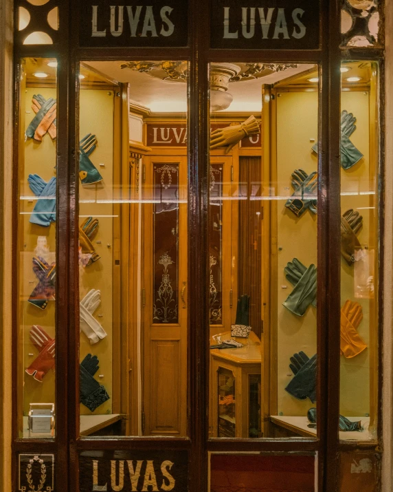 a storefront of glass windows filled with items