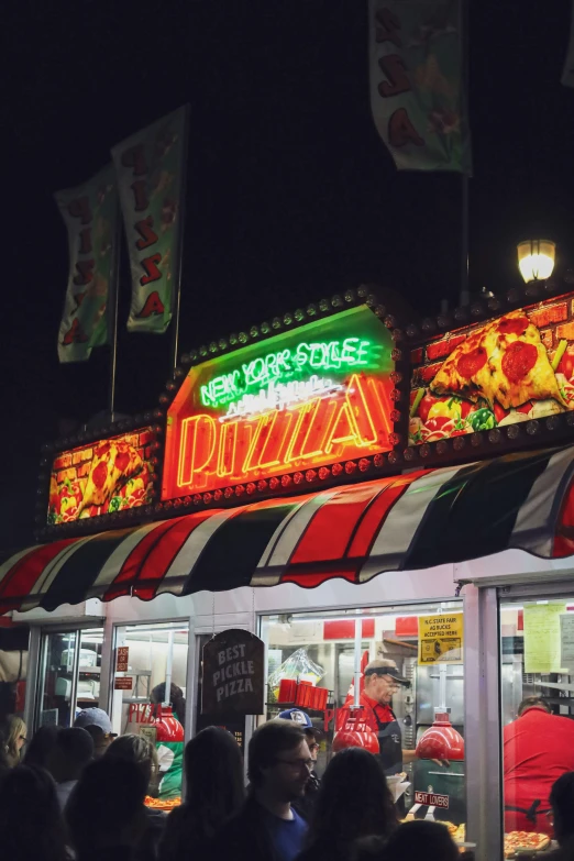 a restaurant filled with lots of food and people around