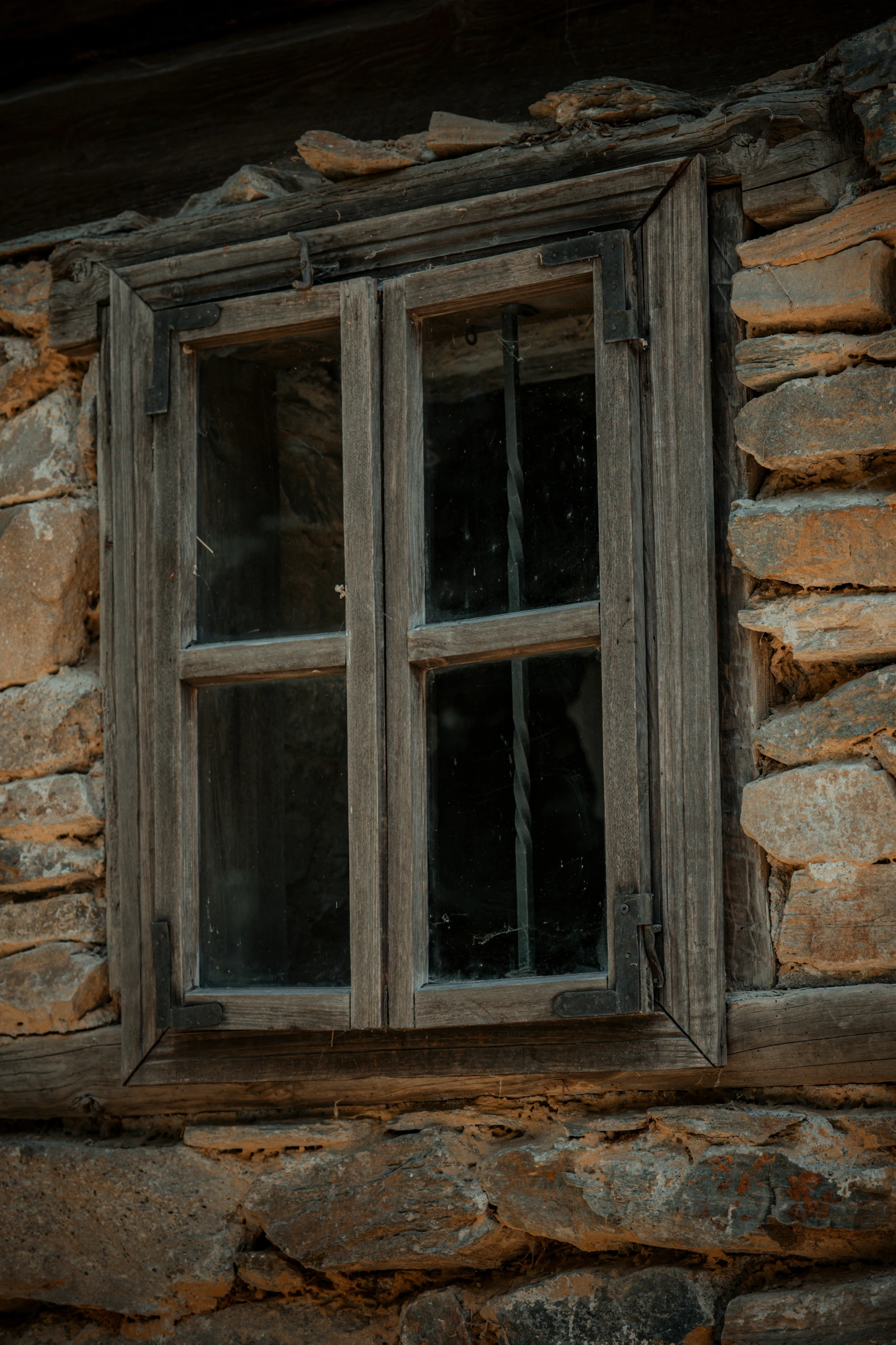 a window in the side of a rock building