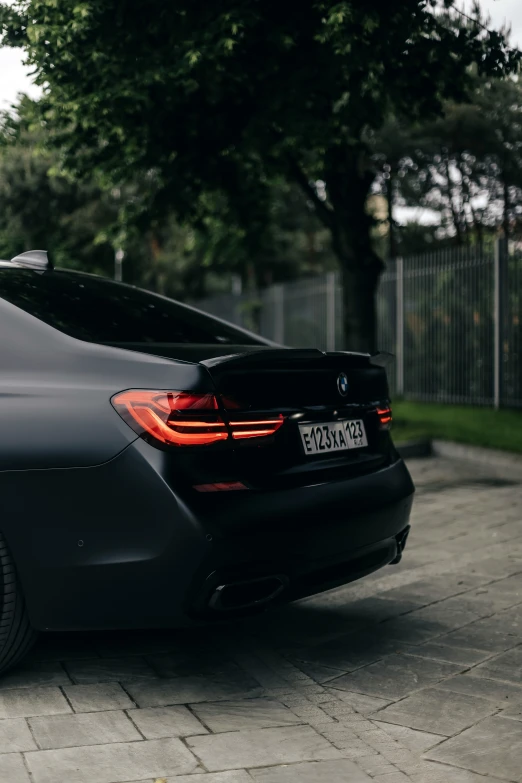 there is a gray bmw parked in the street