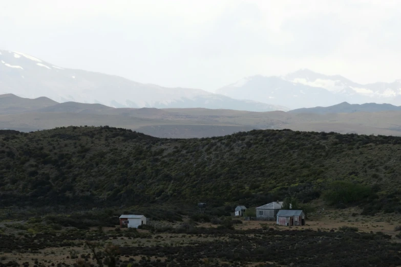 this is a landscape with mountains and the hills covered in vegetation