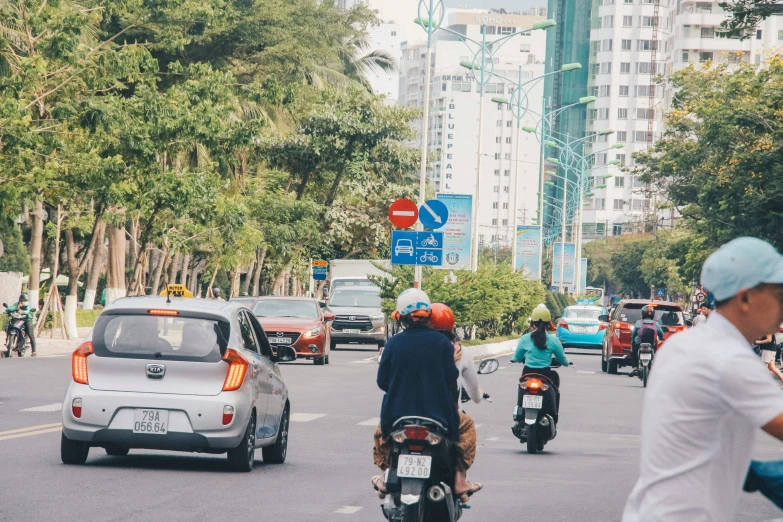 people are riding motorcycles and scooters in the street