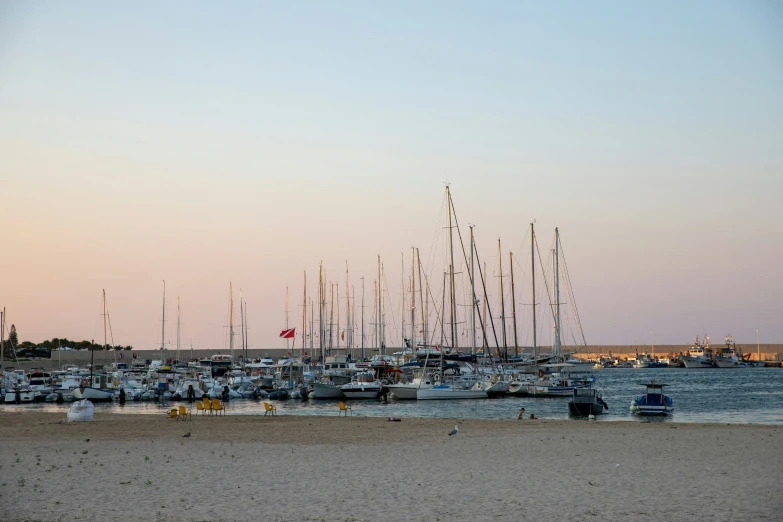 an image of a bunch of boats at the beach