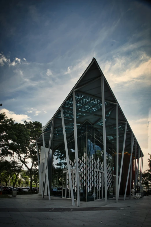 the triangle shaped building has a triangular roof