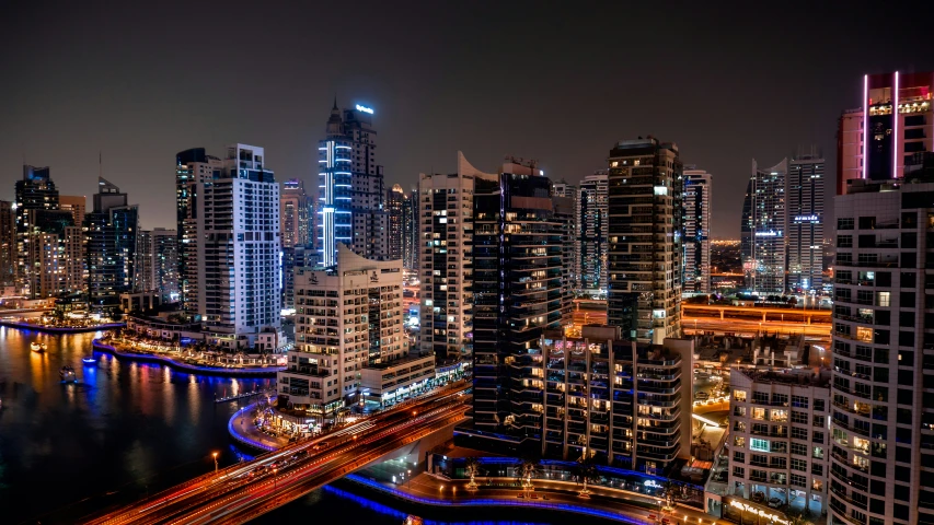 very tall buildings in an urban area at night