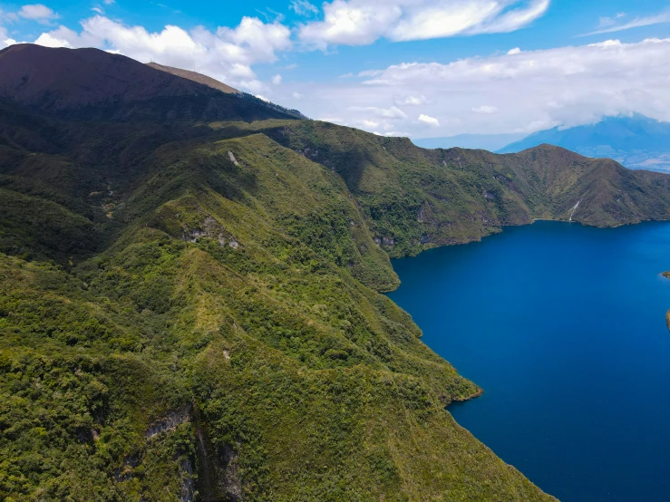 a helicopter that is flying over a lake