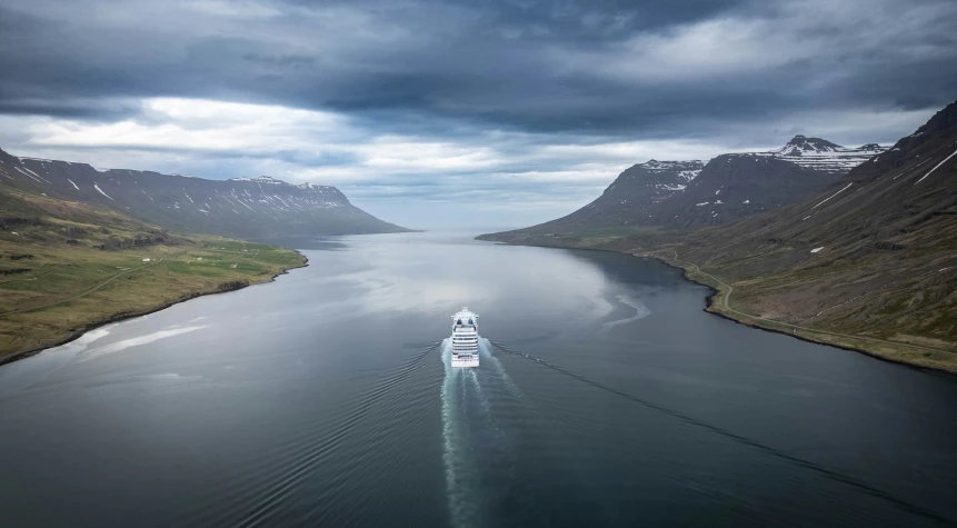 aerial s of boat out in the ocean on cloudy day