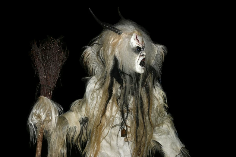 two men with long, hairy hair wearing scary makeup