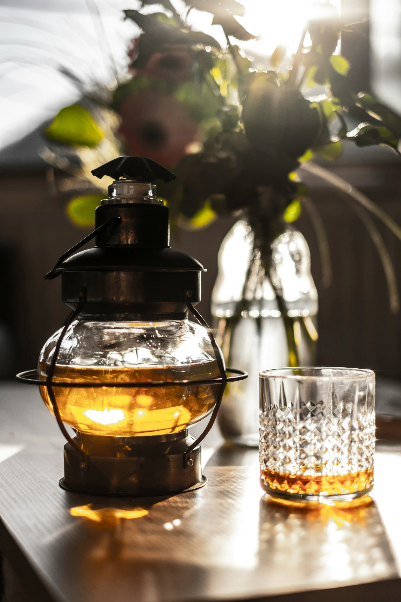 a vase and some glasses on a table