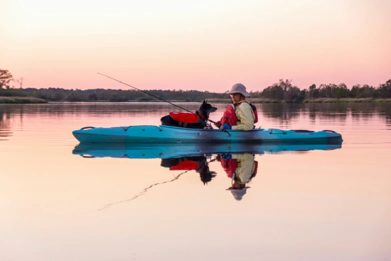 a person that is sitting in a boat on water